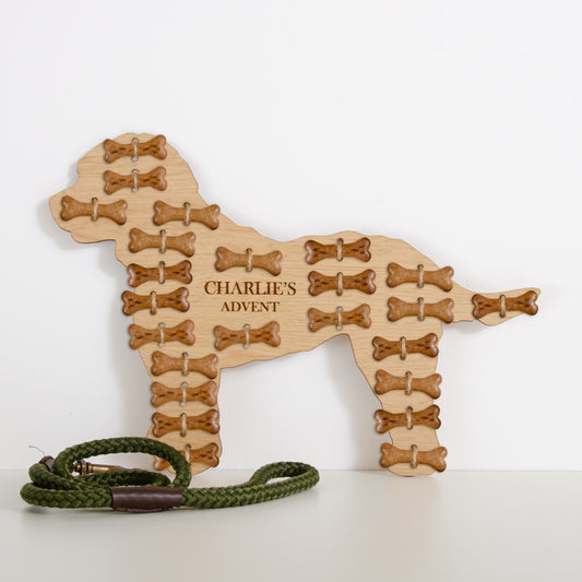 Cockapoo-shaped oak advent calendar engraved "Charlie's Advent" filled with bone treats