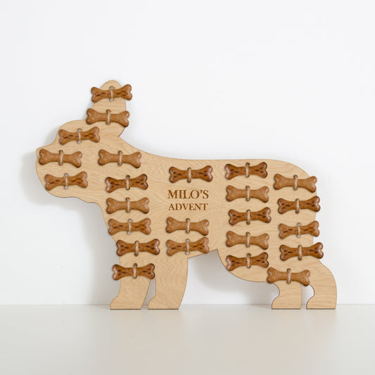 French bulldog-shaped oak advent calendar engraved "Milo's Advent" filled with bone treats