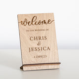 'Welcome to the wedding of' wooden sign