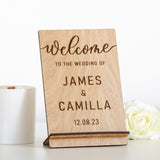 'Welcome to the wedding of' wooden sign