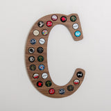 Initial beer cap wall hanging