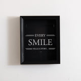 'Every smile tells a story' frame